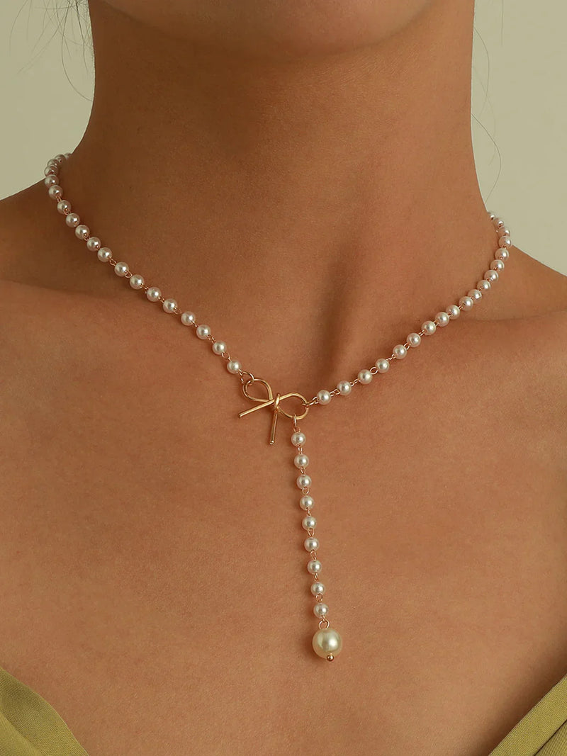 Elegant Bow and Pearl Pendant Necklace